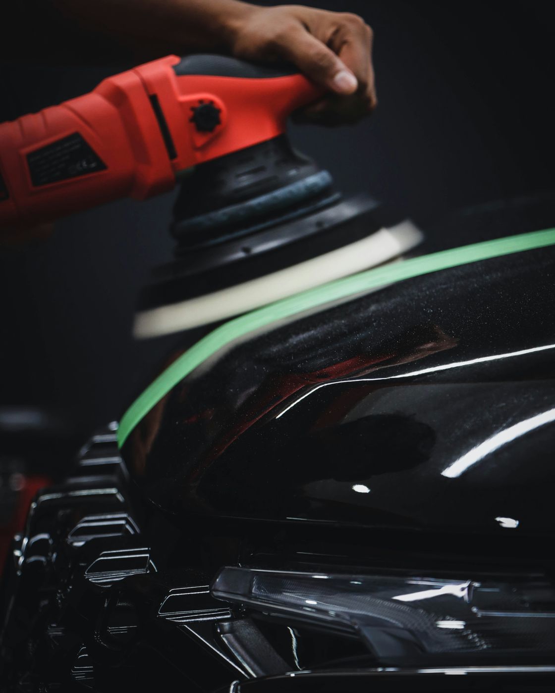 Machine polishing paint during a paint enhancement service by DOS I BROS in Winston-Salem, NC